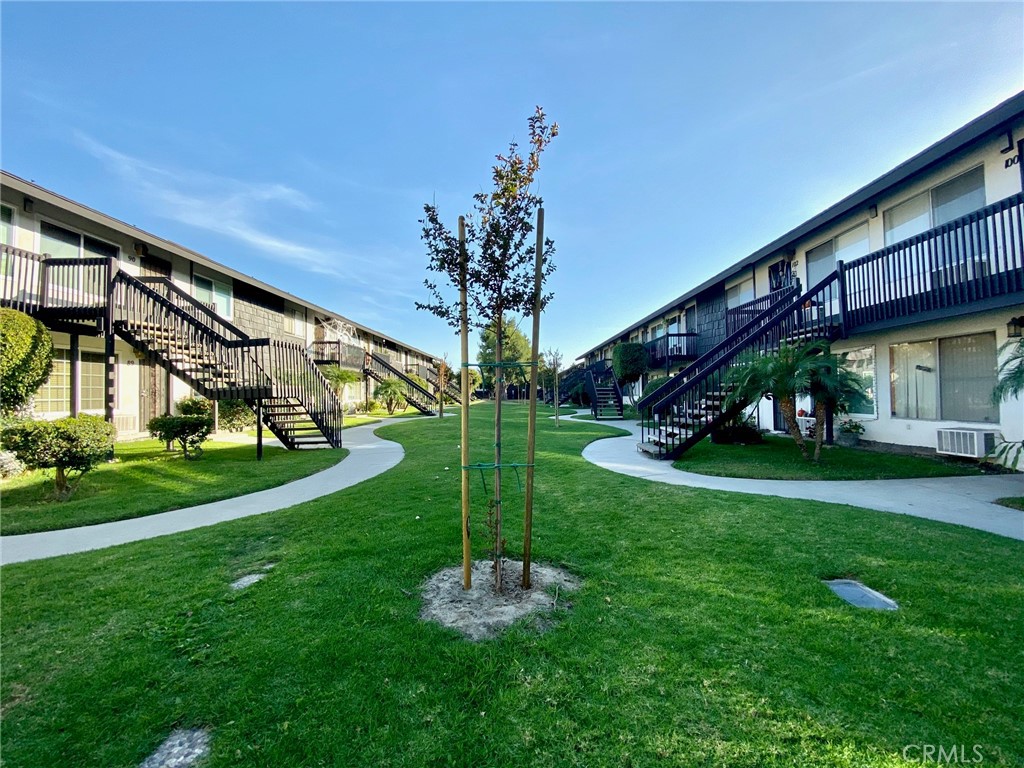 7100 Cerritos Avenue, Unit 85 Stanton, CA 90680 - Photo 2 of 9 a view of a house with a yard