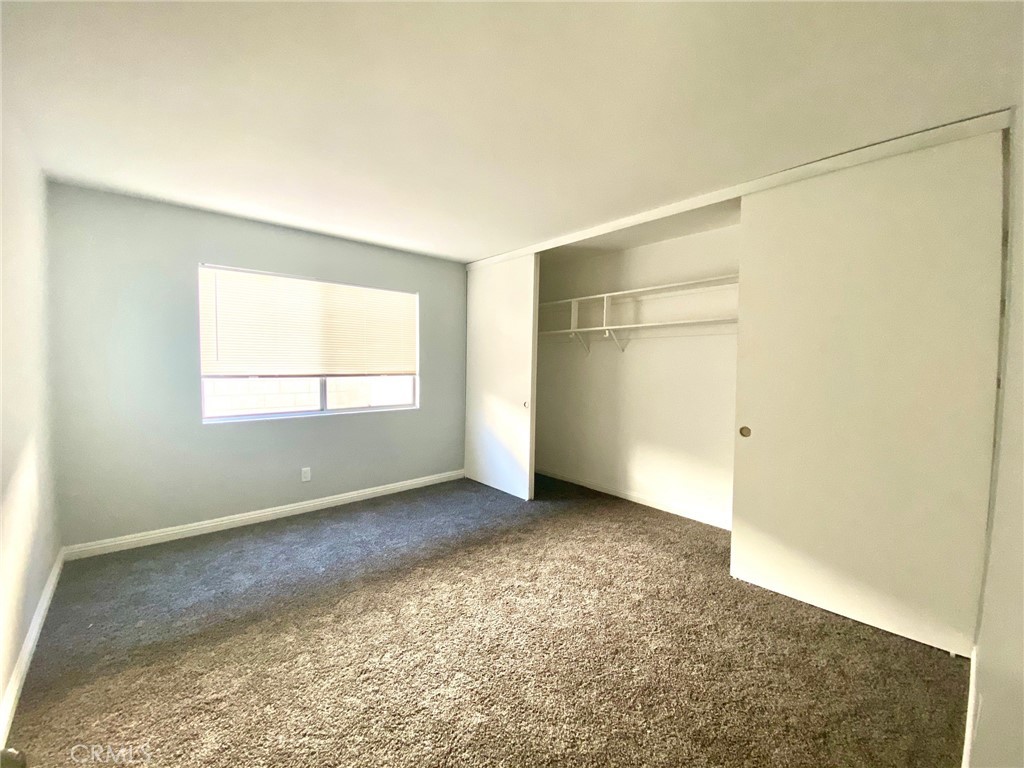 7100 Cerritos Avenue, Unit 85 Stanton, CA 90680 - Photo 8 of 9 a view of an empty room with a window