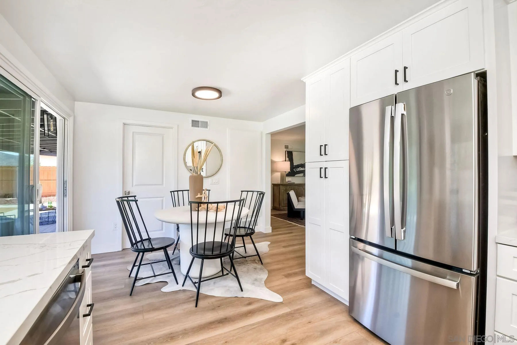 9045 Inverness Road Santee, CA 92071 - Photo 12 of 28 a view of a dining room with furniture window and wooden floor