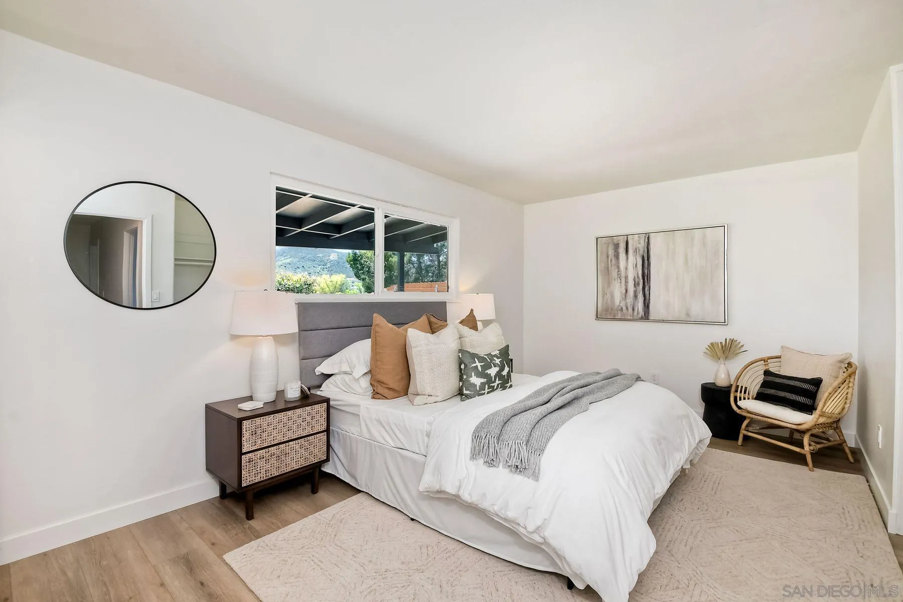 9045 Inverness Road Santee, CA 92071 - Photo 18 of 28 a bedroom with a bed a couch and a window