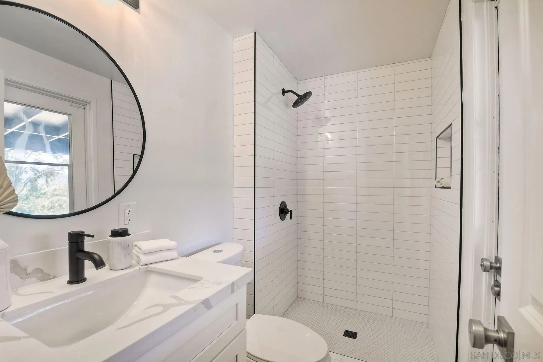 9045 Inverness Road Santee, CA 92071 - Photo 19 of 28 a bathroom with a sink toilet and shower
