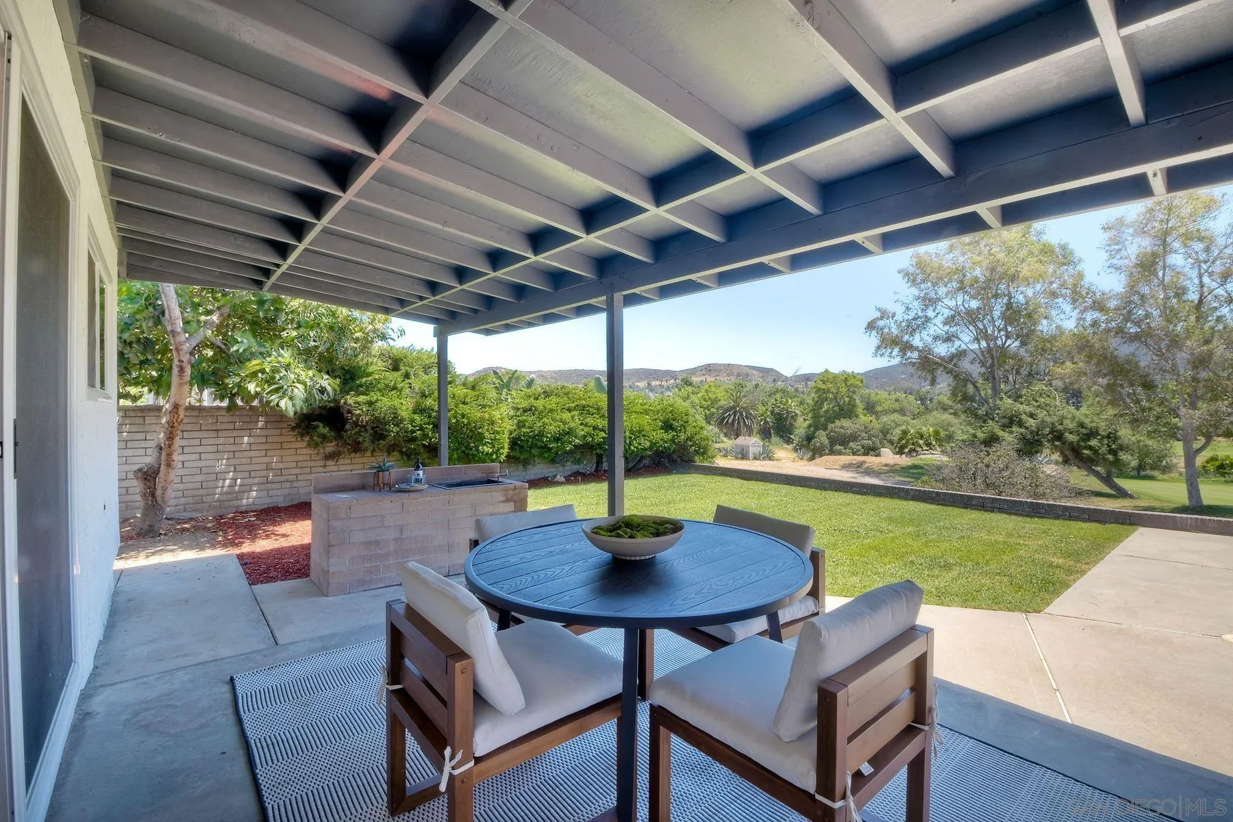 9045 Inverness Road Santee, CA 92071 - Photo 20 of 28 a view of a patio with a table chairs and a table
