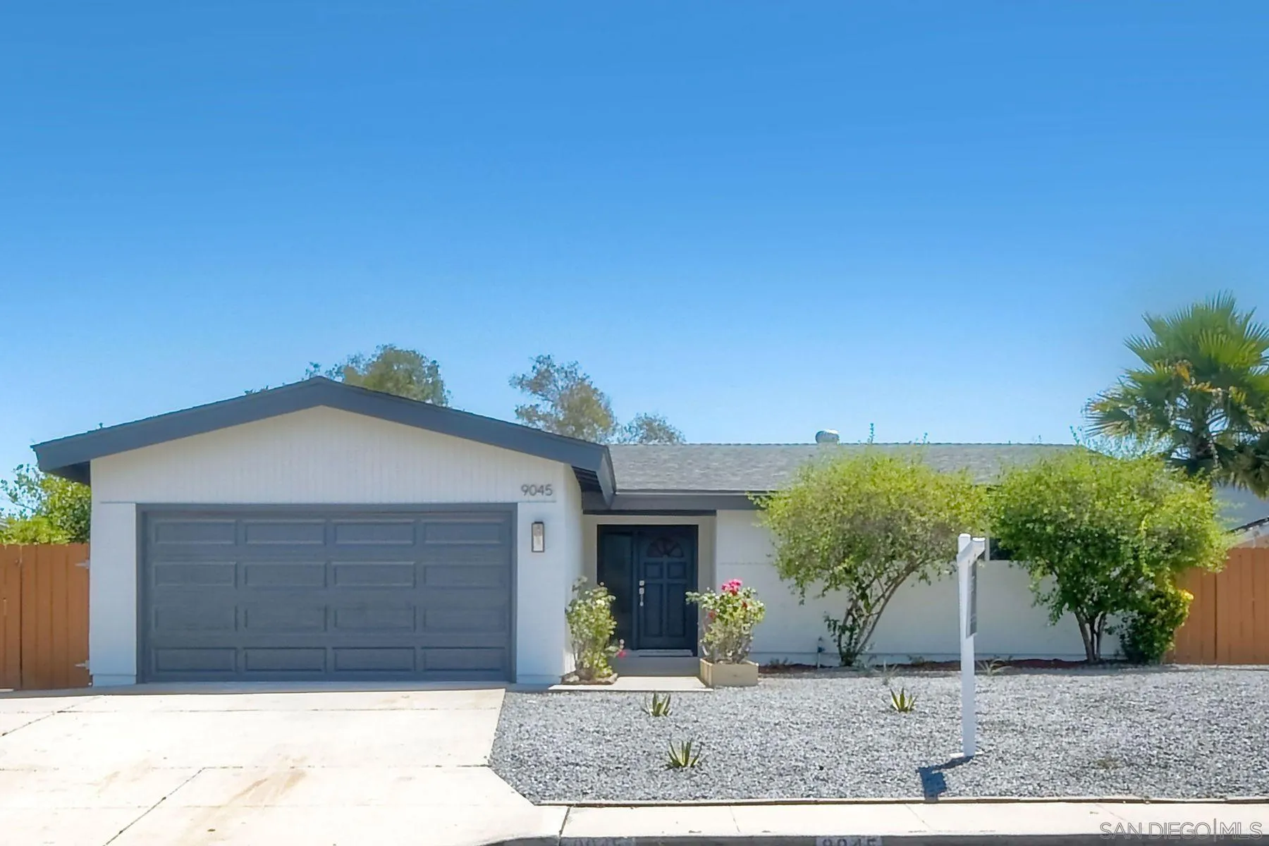 9045 Inverness Road Santee, CA 92071 - Photo 2 of 28 a front view of a house with garden