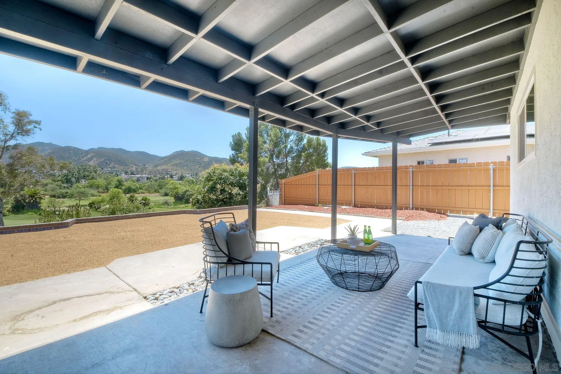 9045 Inverness Road Santee, CA 92071 - Photo 21 of 28 a view of a patio with couches chairs and potted plants