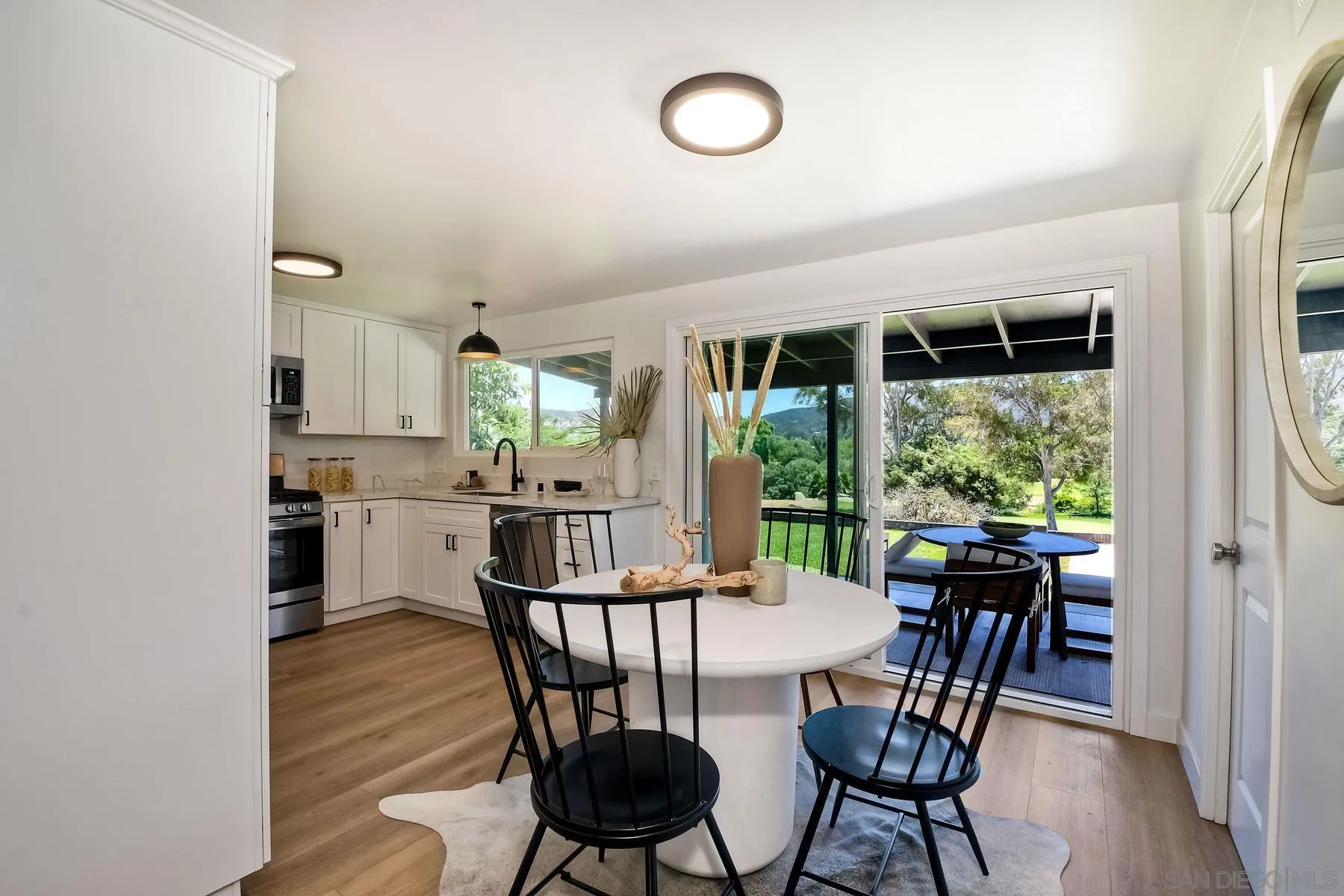 9045 Inverness Road Santee, CA 92071 - Photo 7 of 28 a view of a dining room with furniture window and wooden floor