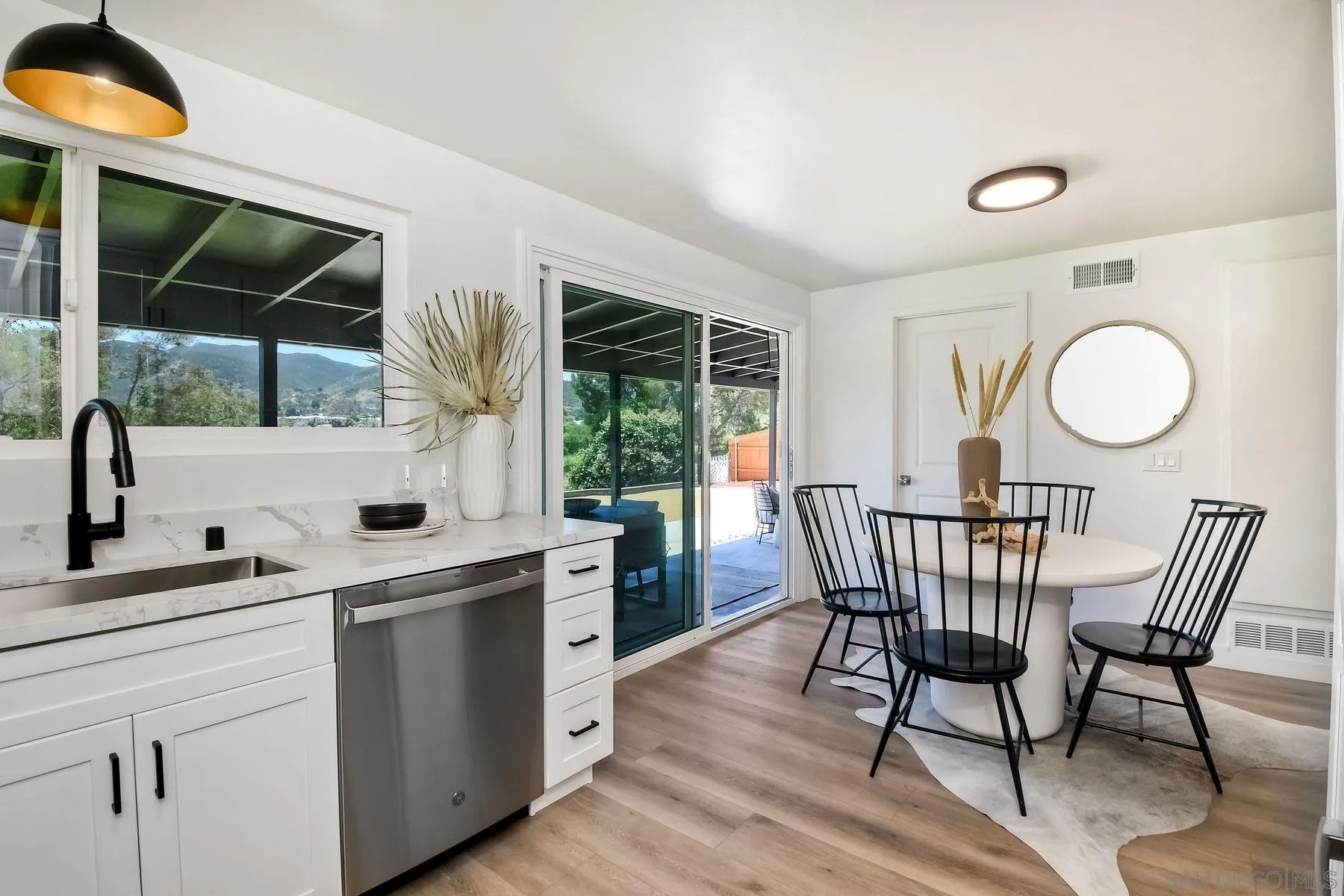 9045 Inverness Road Santee, CA 92071 - Photo 9 of 28 a view of a kitchen area with furniture window and wooden floor