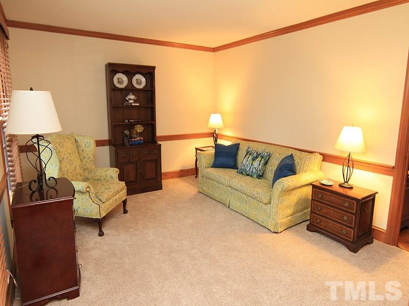 116 Hartland Court Raleigh, NC 27614 - Photo 12 of 25 Currently used as a living room but easily converts to home office or music room! New carpet, paint and windows (here and dining room) have been added in 2016.