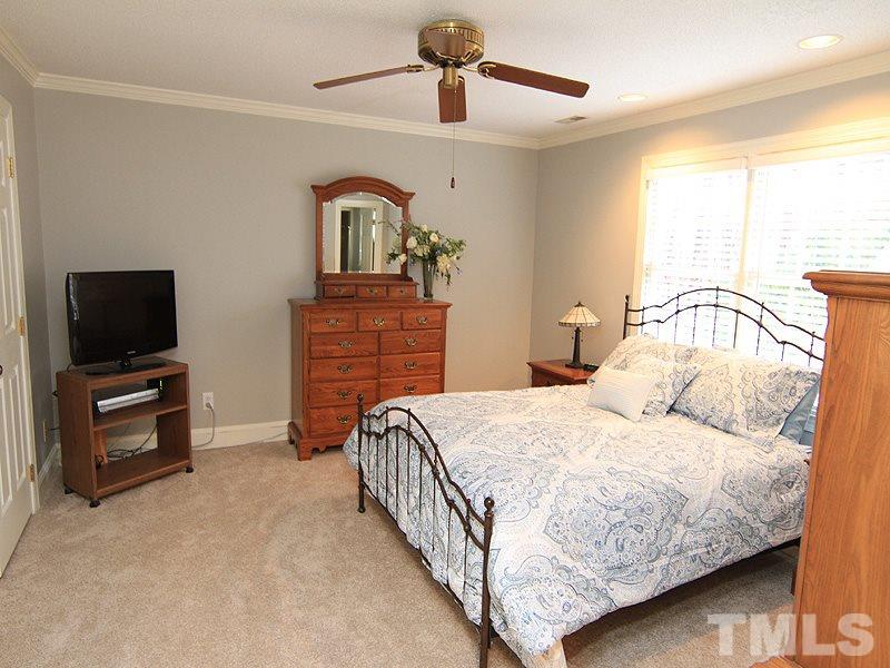 116 Hartland Court Raleigh, NC 27614 - Photo 13 of 25 Master bedroom as large double closet, cable access, ceiling fan, master bath with stand up shower. Recently repainted in newer grey shade come enjoy this soothing space.