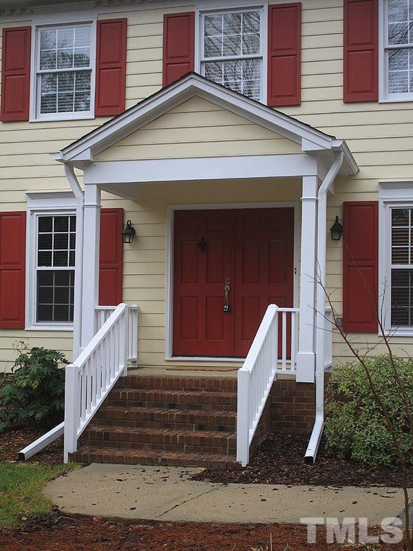 116 Hartland Court Raleigh, NC 27614 - Photo 20 of 25 Your guests will not have to stand in the rain. Wide stair case into the home, double doors easy to bring furniture in and out of, and side walk has recently been re-leveled for ease of access by all.