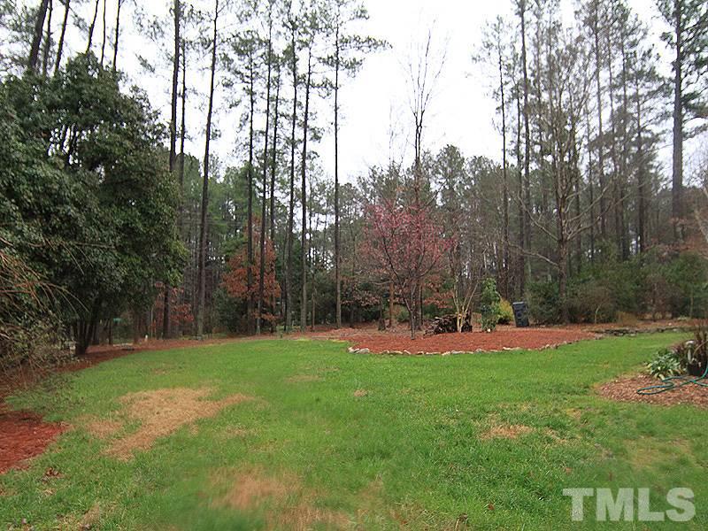 116 Hartland Court Raleigh, NC 27614 - Photo 3 of 25 Expansive backyard to play, add the swing set, put in the gardens, built a fire pit or install the volleyball net. Come enjoy the privacy this lot gives at the end of the cul de sac.
