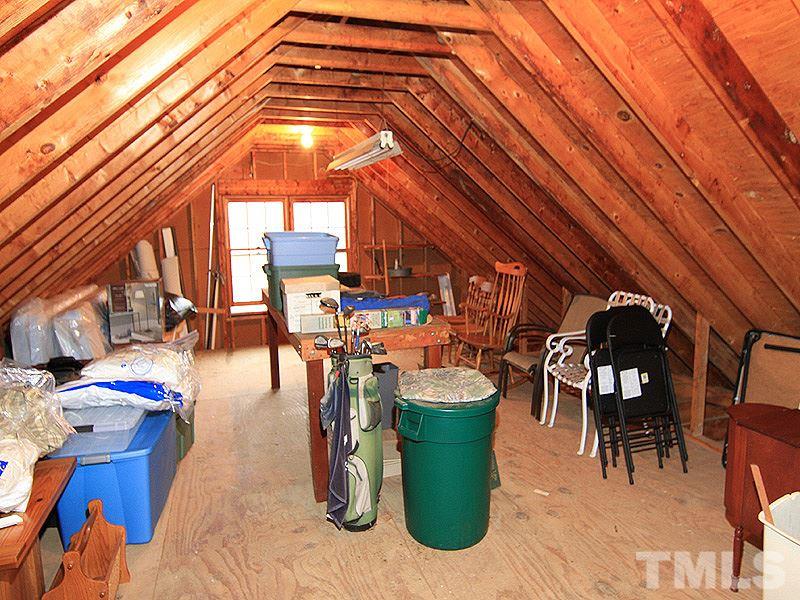 116 Hartland Court Raleigh, NC 27614 - Photo 22 of 25 Plenty of Storage over the garage. Fully floored and well lit with windows on both ends. Over 26 feet long you have an easy space to maneuver around in.