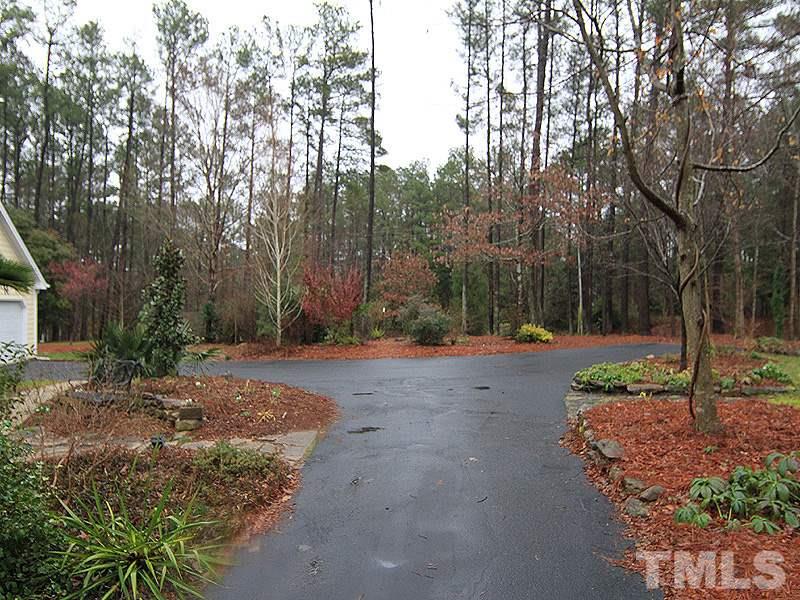 116 Hartland Court Raleigh, NC 27614 - Photo 24 of 25 Extended driveway has additional parking pad making it easy for multi-car families to not have to shuffle cars around. Recently repaved.