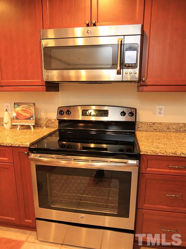 116 Hartland Court Raleigh, NC 27614 - Photo 6 of 25 Stainless steel dishwasher, microwave and stove do convey.