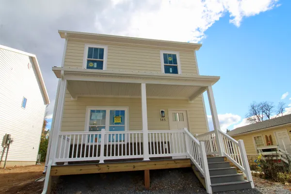 a view of a house with wooden deck