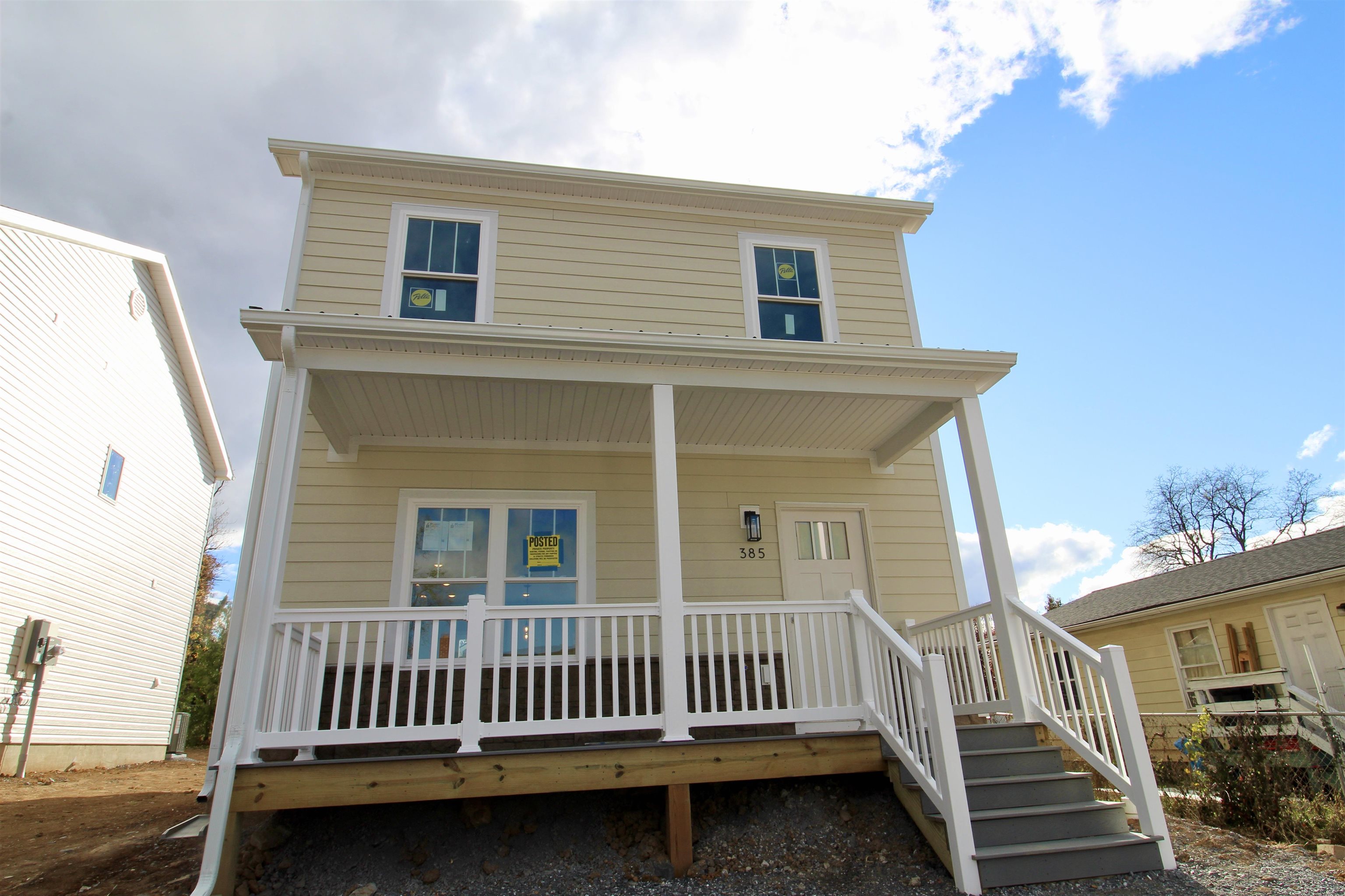 a view of a house with wooden deck
