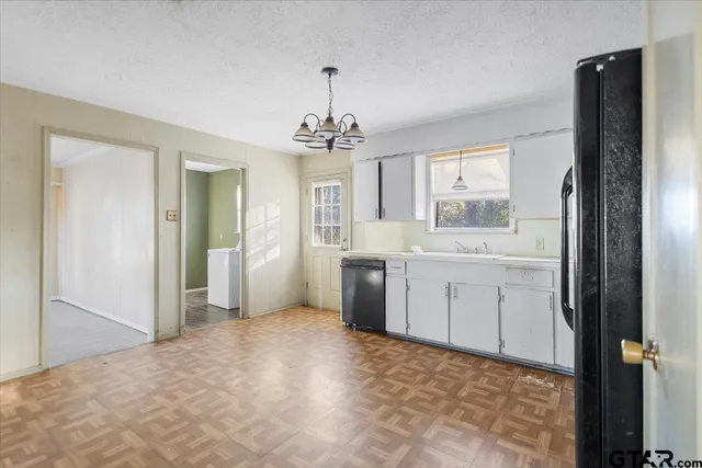a bathroom with a sink vanity and a mirror