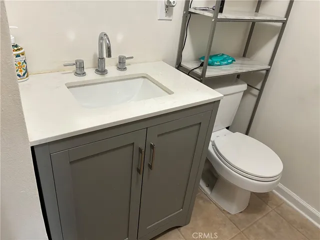 a bedroom with a bed and a table