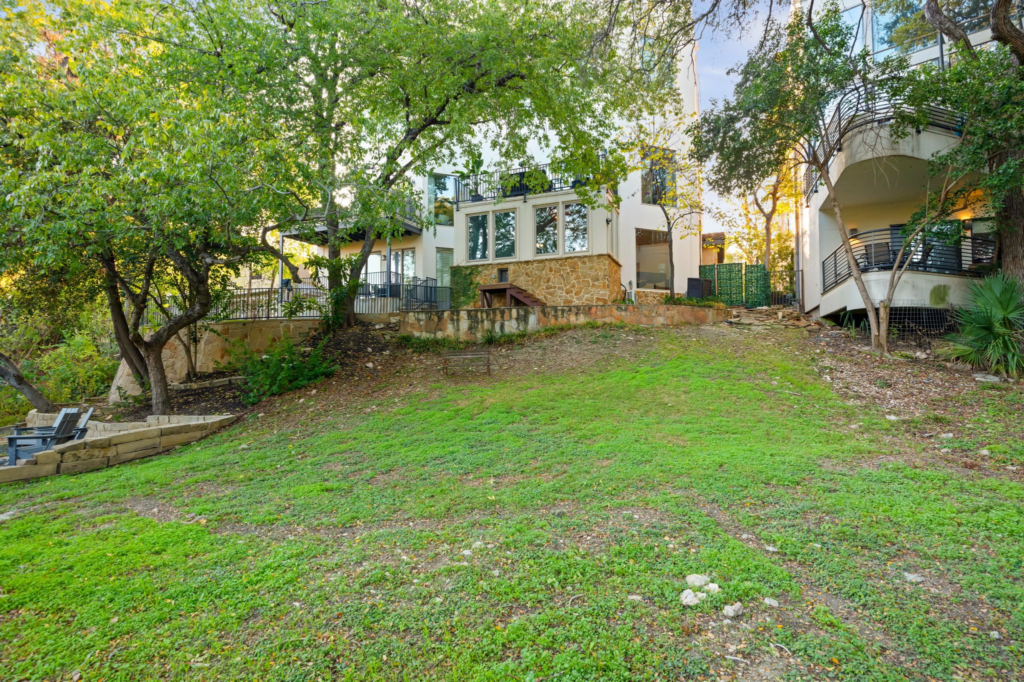 1231 Parkway, Unit 2 Austin, TX 78703 - Photo 36 of 40 Currently a low maintenance natural haven leading to the creek, but a custom landscape could transform this large outdoor space