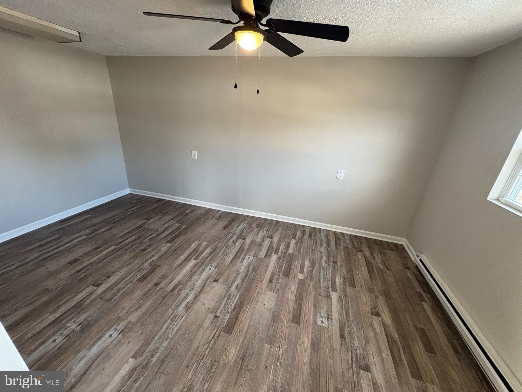 2 Kent Road Elkton, MD 21921 - Photo 8 of 17 wooden floor in an empty room with a window