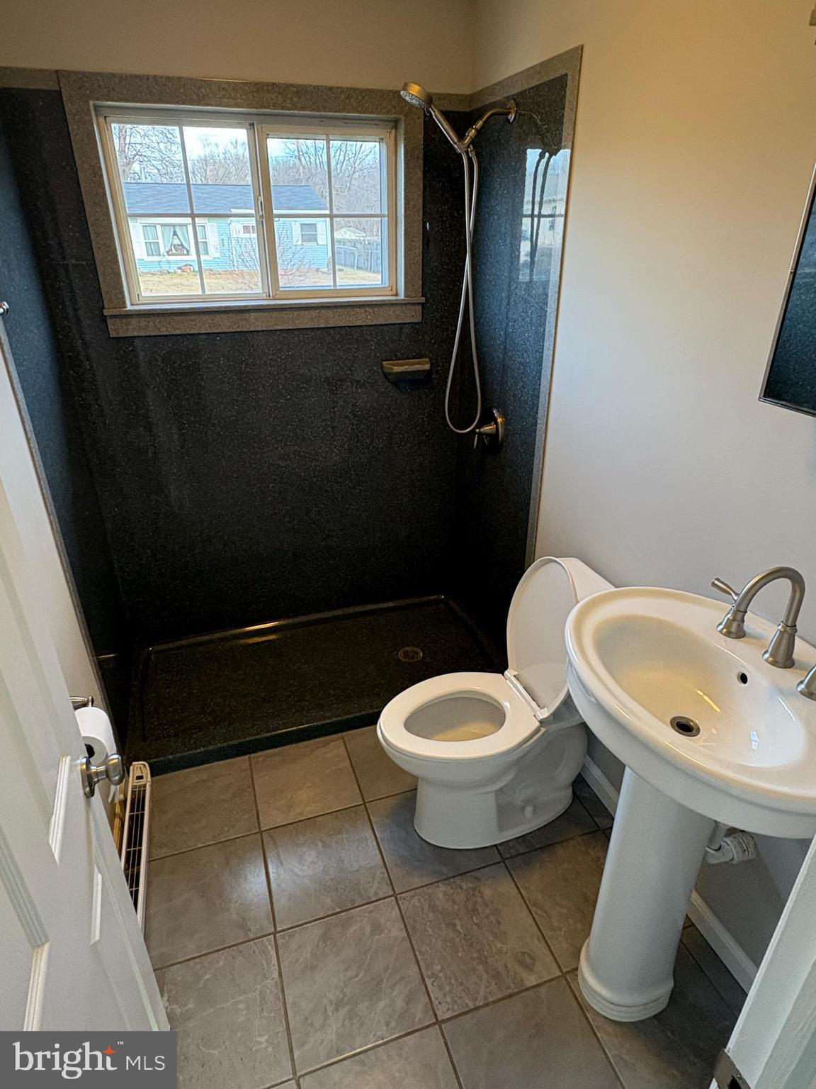 2 Kent Road Elkton, MD 21921 - Photo 10 of 17 a white toilet sitting next to a bathroom sink