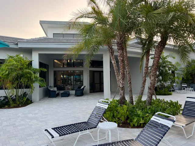 a view of a backyard with sitting area