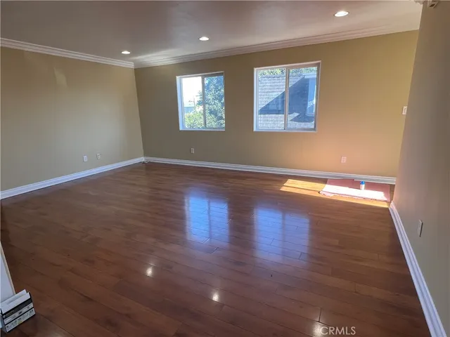 a view of gallery with wooden floor