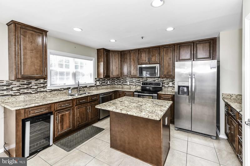 2 Parker Farm Court Silver Spring, MD 20906 - Photo 19 of 34 a kitchen with stainless steel appliances granite countertop a stove refrigerator sink and dishwasher