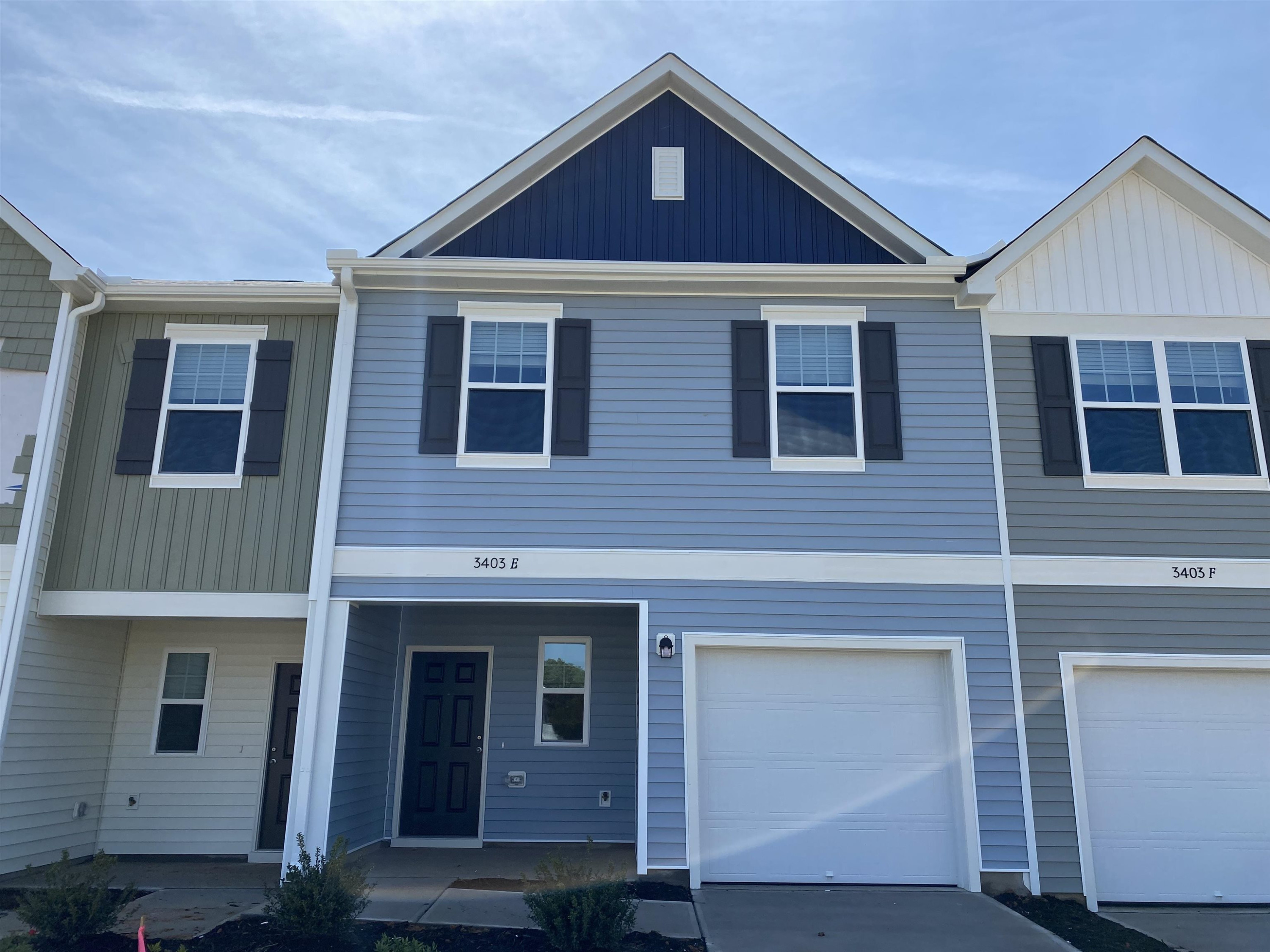 a front view of a house with yard