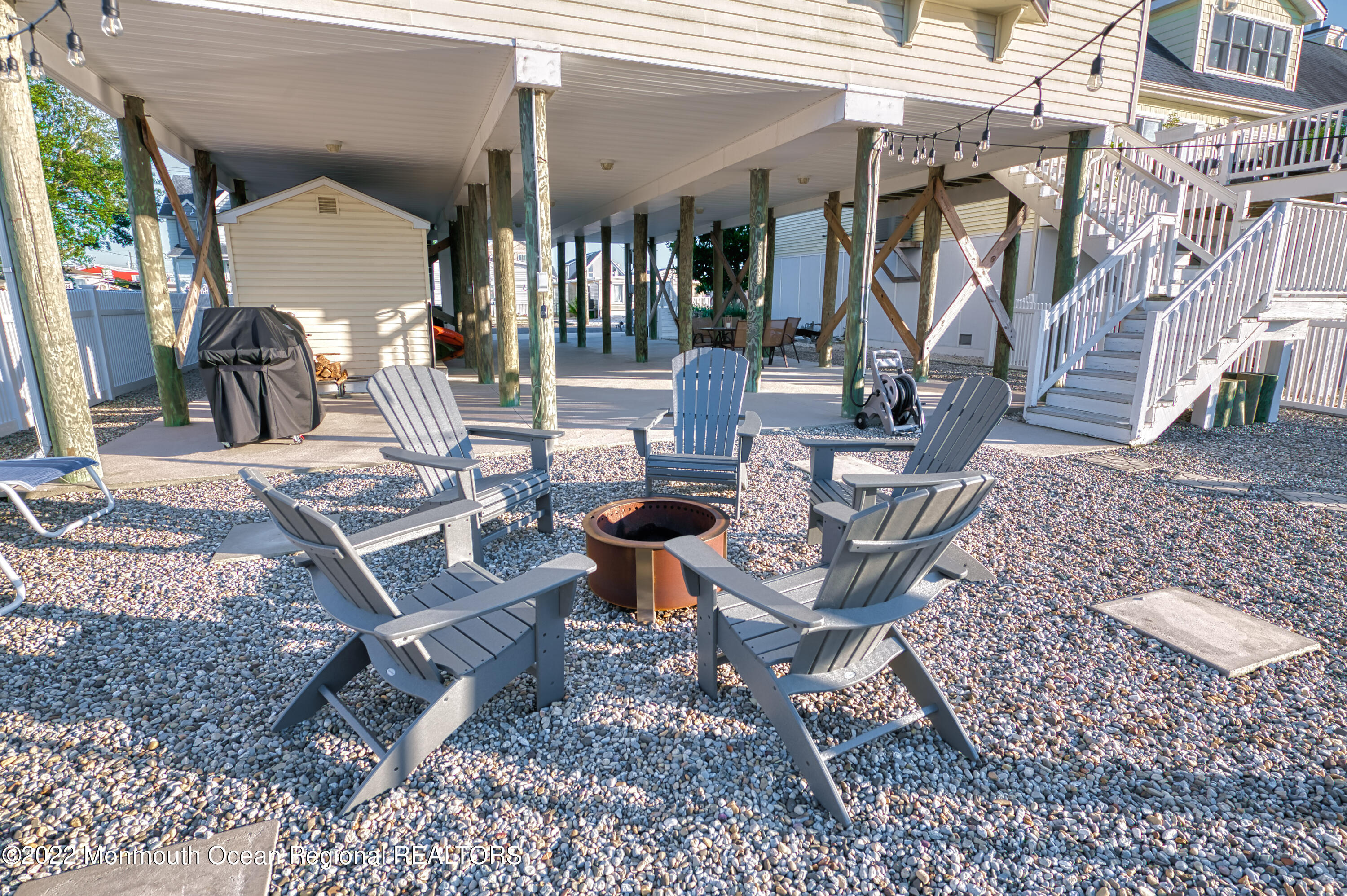 98 Dolphin Road Tuckerton, NJ 08087 - Photo 18 of 43 a view of a dinning tables and chairs in backyard