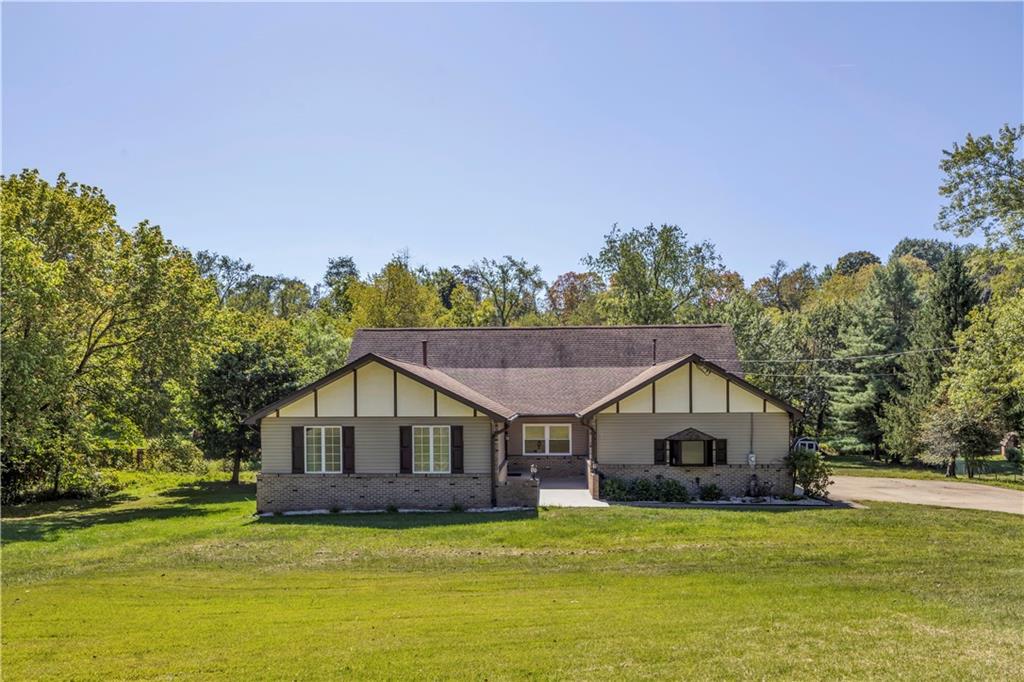 2171 Robbins Station Road Irwin, PA 15642 - Photo 2 of 50 This home features a spacious lot with lush landscaping and a charming exterior.