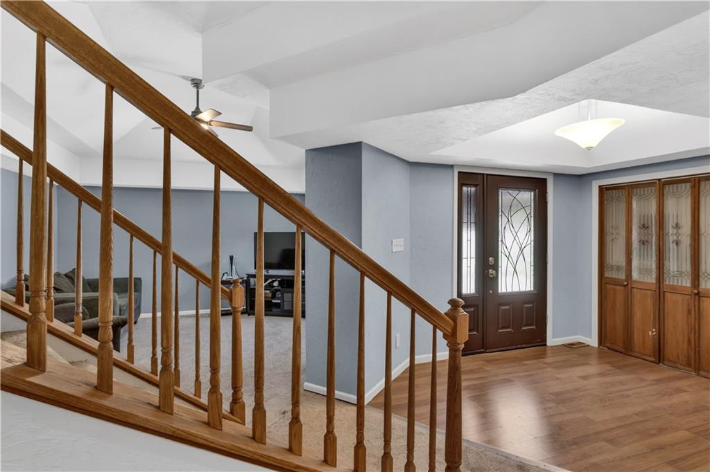 2171 Robbins Station Road Irwin, PA 15642 - Photo 25 of 50 Another view of the entry featuring a wide staircase, gorgeous new front door & vaulted ceilings