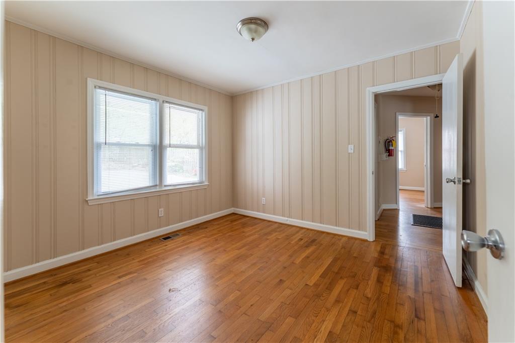 1387 Church Street Decatur, GA 30030 - Photo 15 of 37 an empty room with wooden floor and windows