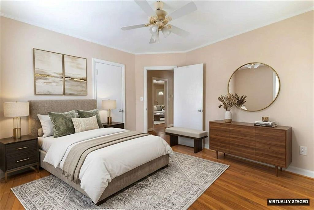 1387 Church Street Decatur, GA 30030 - Photo 18 of 37 a bed room with a bed and a chandelier