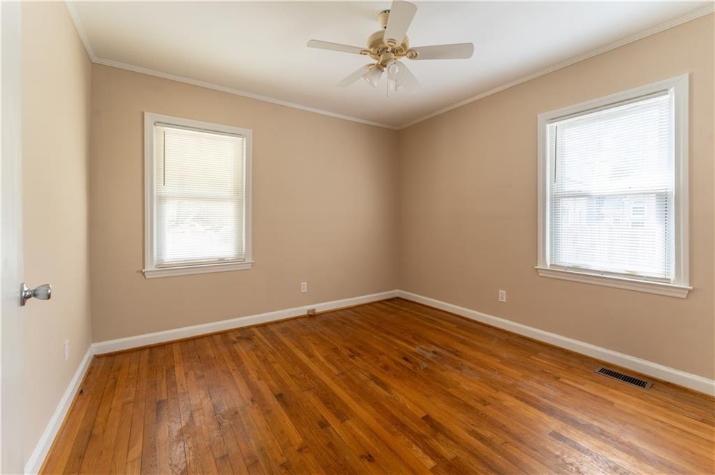 1387 Church Street Decatur, GA 30030 - Photo 21 of 37 a view of an empty room with wooden floor and a window