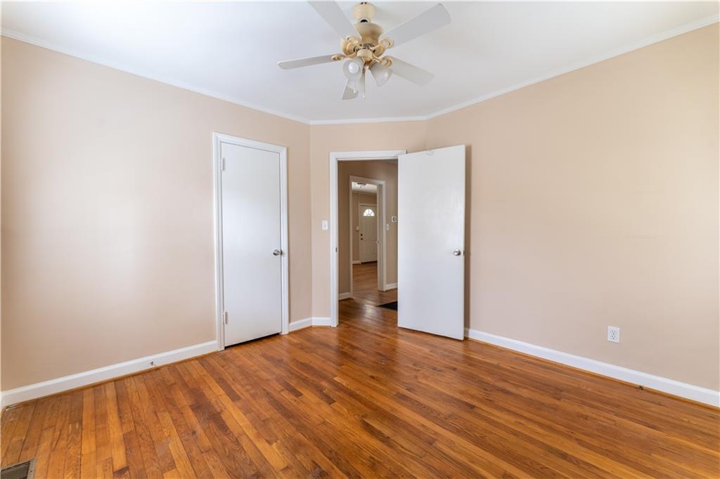 1387 Church Street Decatur, GA 30030 - Photo 22 of 37 a view of a room with wooden floor and a ceiling fan