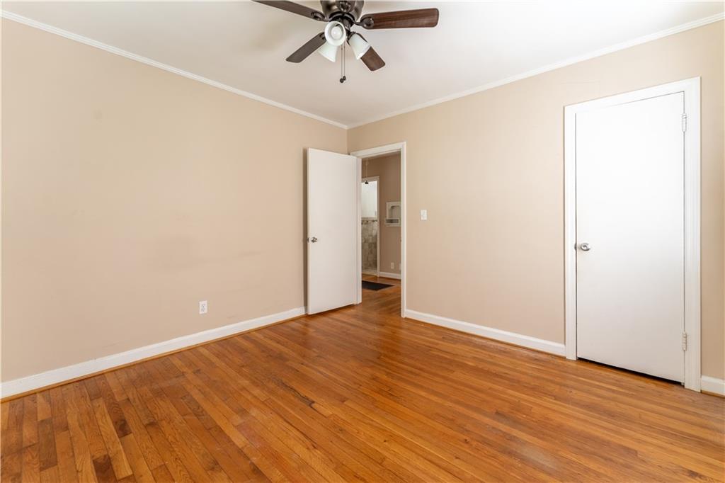 1387 Church Street Decatur, GA 30030 - Photo 24 of 37 an empty room with wooden floor fan and windows