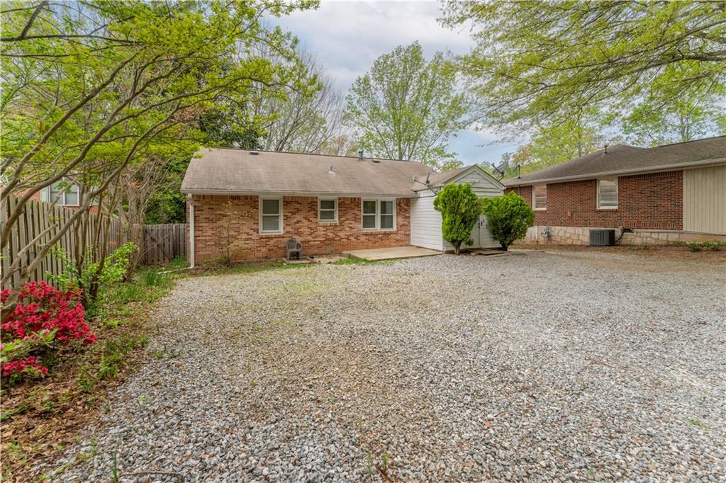 1387 Church Street Decatur, GA 30030 - Photo 28 of 37 a view of a house with a yard and potted plants