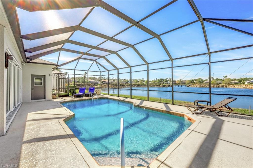 a view of a swimming pool with a porch