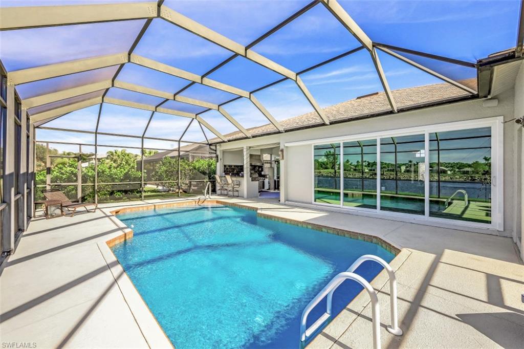 21641 Helmsdale Run Estero, FL 33928 - Photo 11 of 35 a view of a backyard with a swimming pool