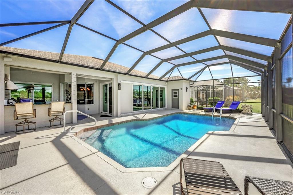 21641 Helmsdale Run Estero, FL 33928 - Photo 12 of 35 a view of a patio with a table and chairs