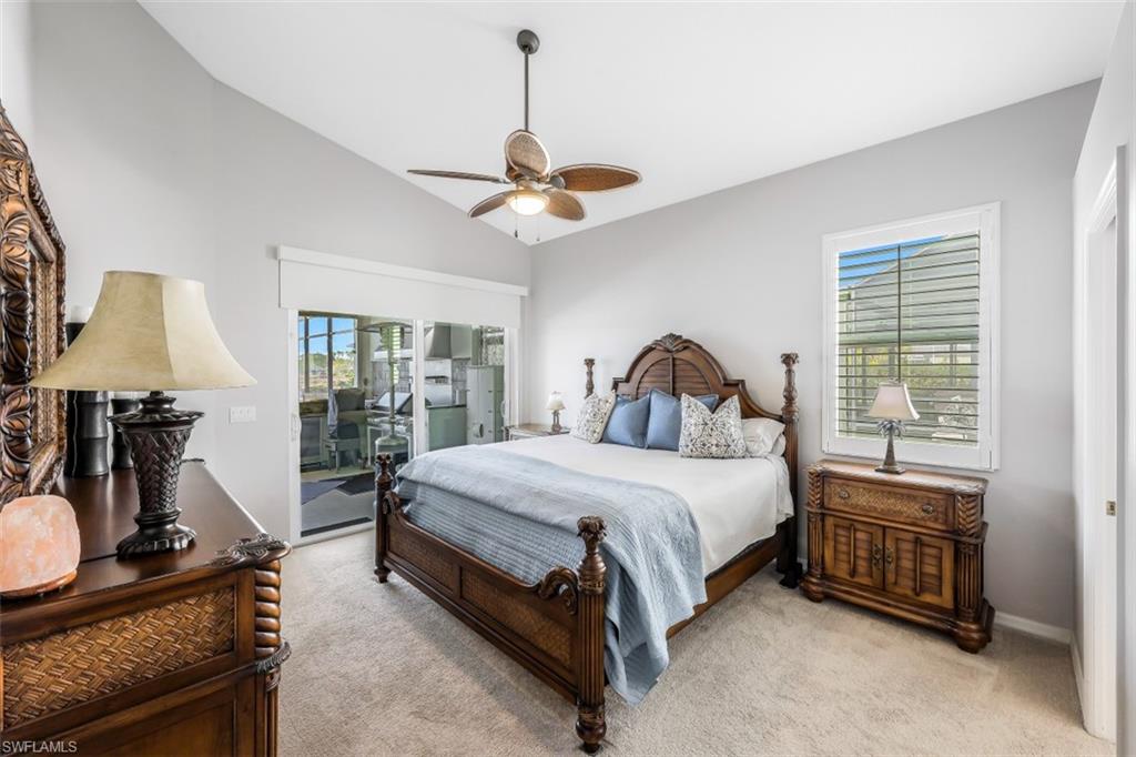 21641 Helmsdale Run Estero, FL 33928 - Photo 14 of 35 a bedroom with a bed wooden floor and a flat tv screen on dresser