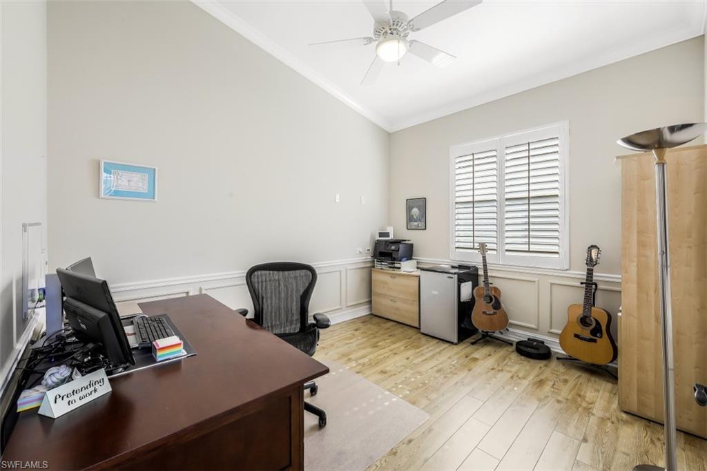 21641 Helmsdale Run Estero, FL 33928 - Photo 19 of 35 a room with furniture and a window