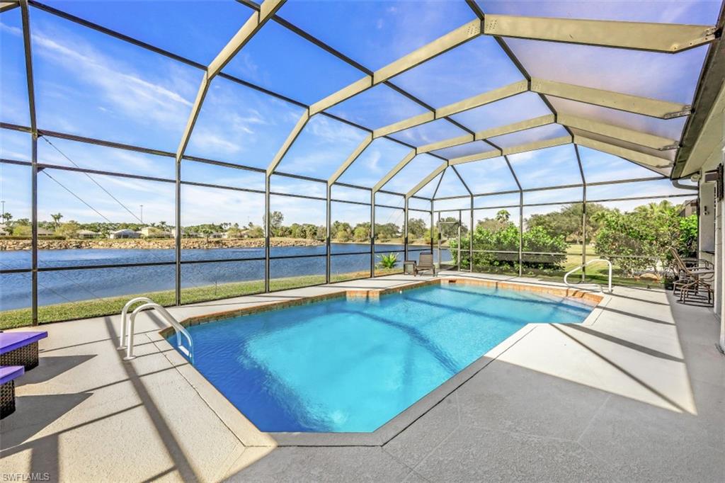 21641 Helmsdale Run Estero, FL 33928 - Photo 2 of 35 a view of a swimming pool with a porch