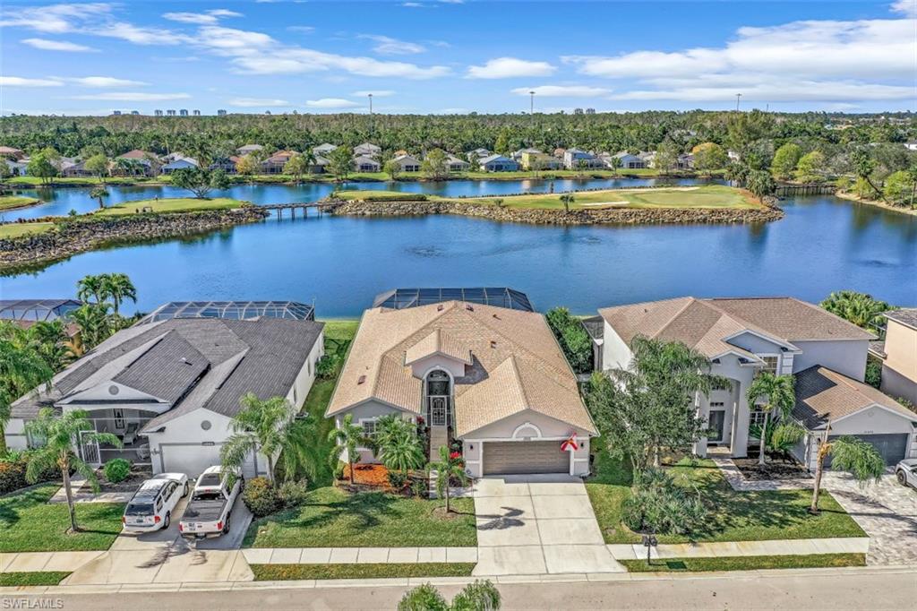 21641 Helmsdale Run Estero, FL 33928 - Photo 25 of 35 an aerial view of a house with outdoor space and lake view
