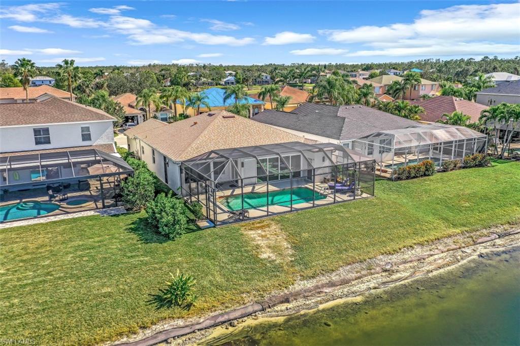 21641 Helmsdale Run Estero, FL 33928 - Photo 26 of 35 an aerial view of a house with a garden and lake view