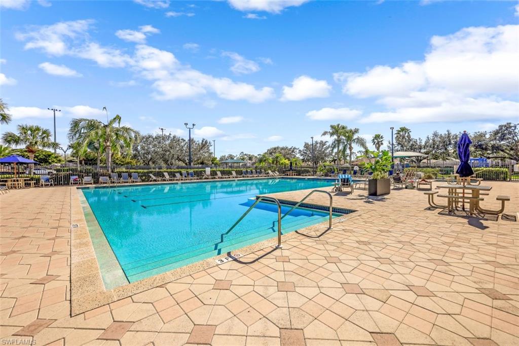 21641 Helmsdale Run Estero, FL 33928 - Photo 35 of 35 a view of a swimming pool with a lounge chair
