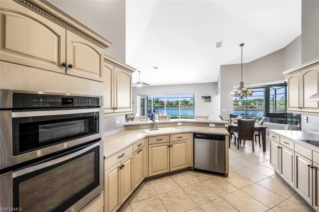 21641 Helmsdale Run Estero, FL 33928 - Photo 8 of 35 a kitchen with lots of appliances and cabinets