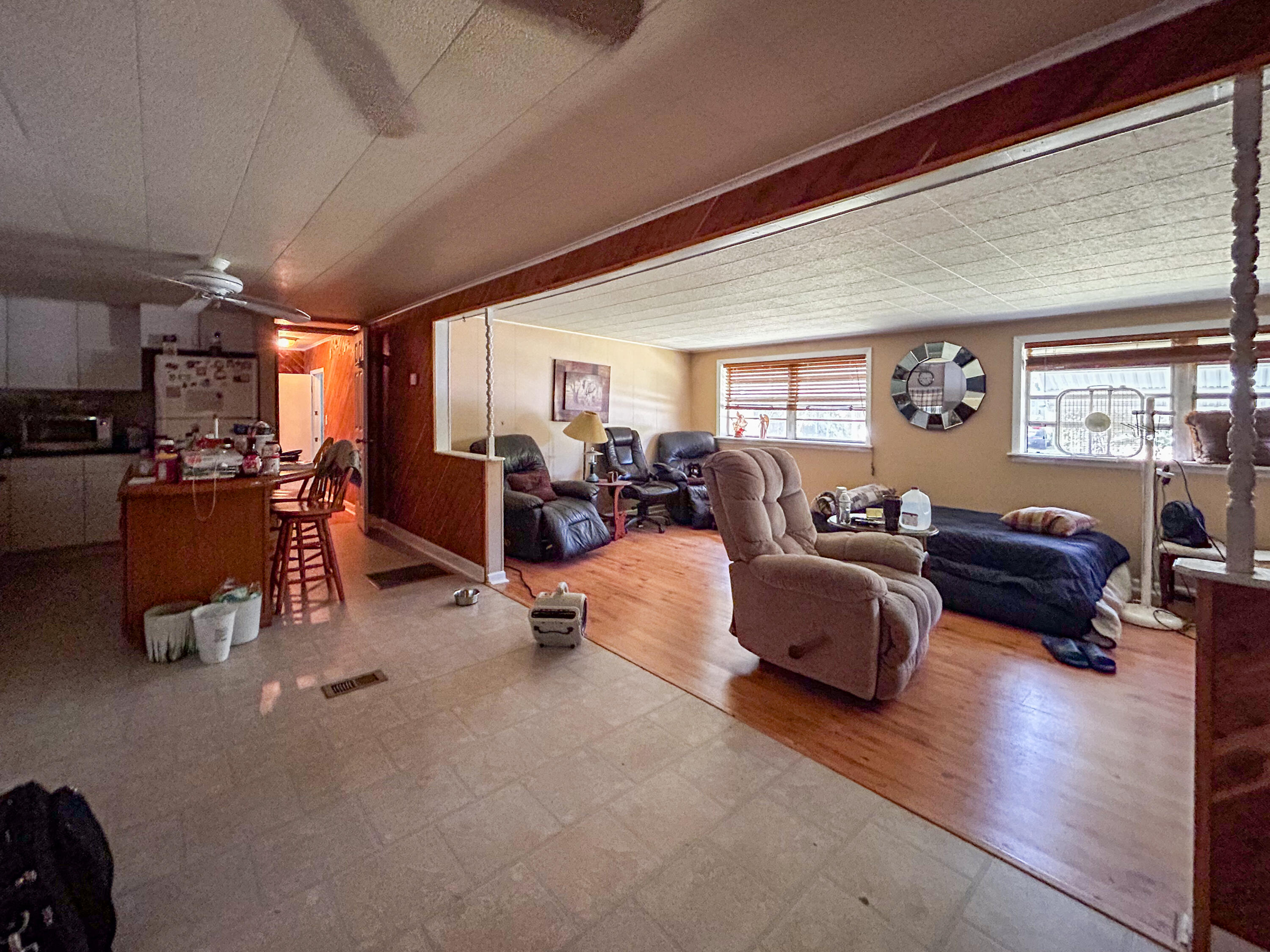2446 Southeast Carroll Street Stuart, FL 34997 - Photo 12 of 37 a living room with furniture and a large window