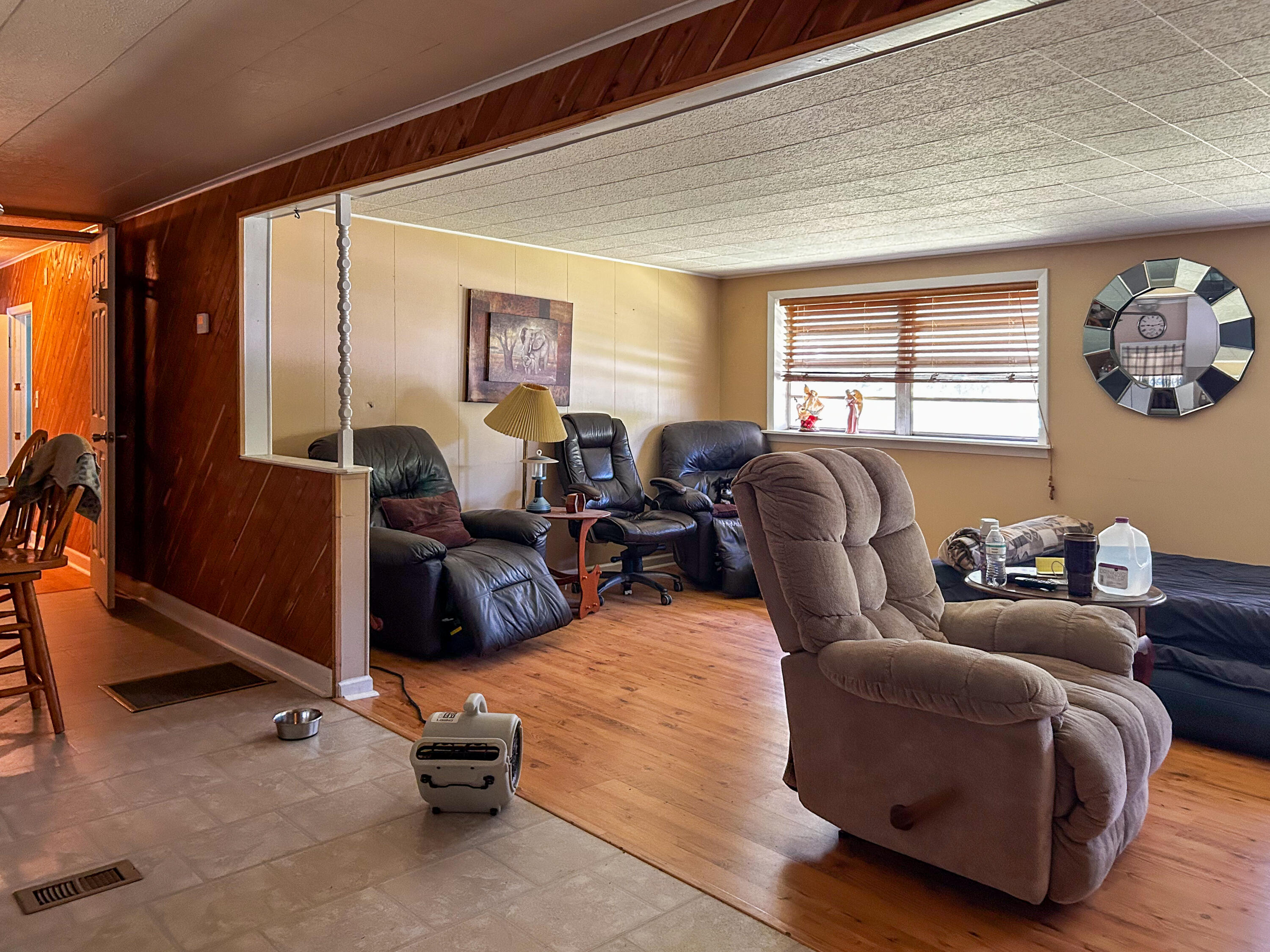 2446 Southeast Carroll Street Stuart, FL 34997 - Photo 13 of 37 a living room with furniture gym equipment and a large window