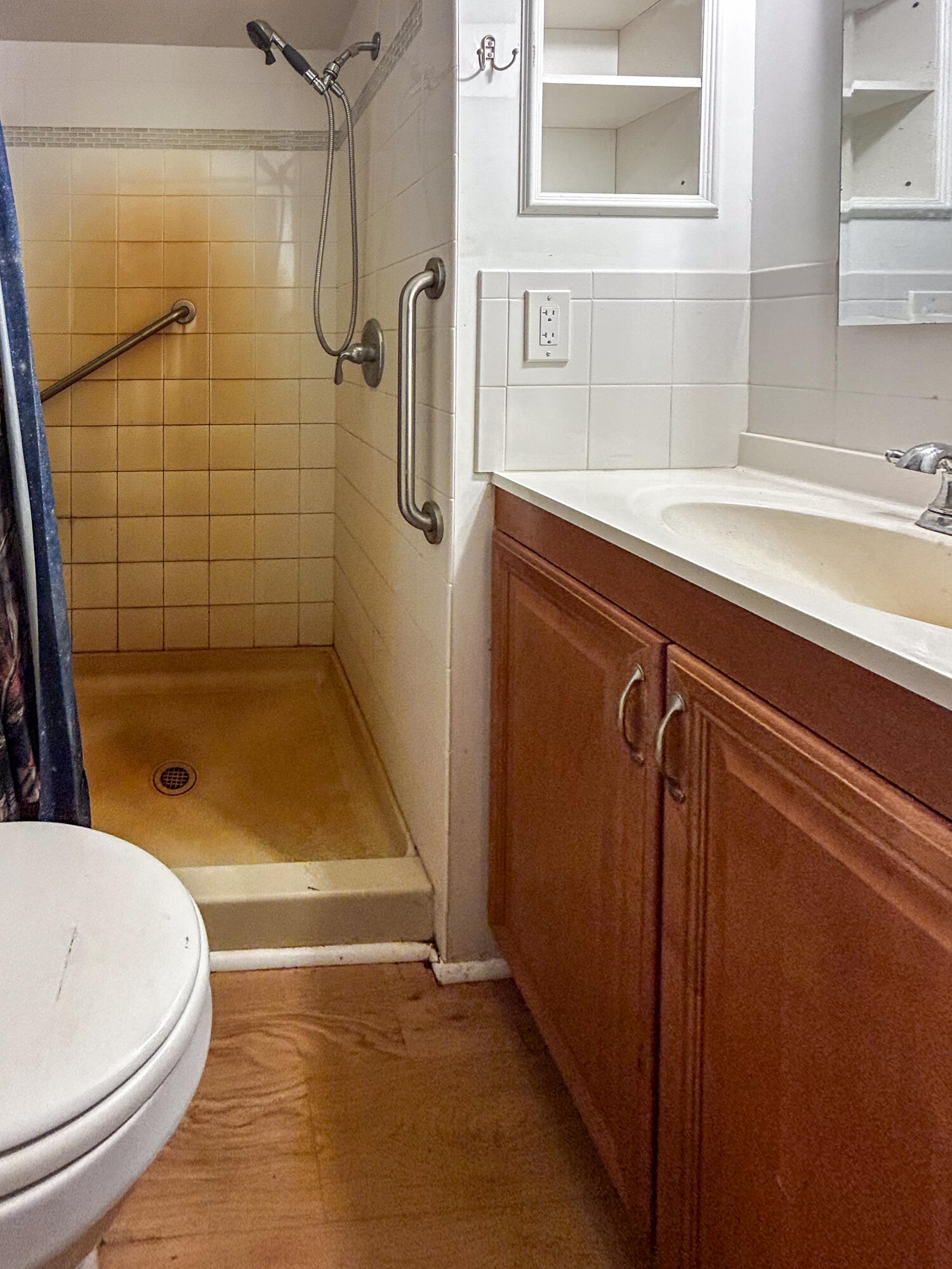 2446 Southeast Carroll Street Stuart, FL 34997 - Photo 18 of 37 a bathroom with a sink and a shower